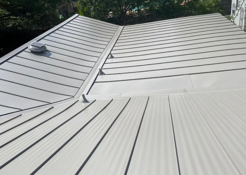 Solar attic fan installed on a metal roof for Roof Ventilation in Yuba City